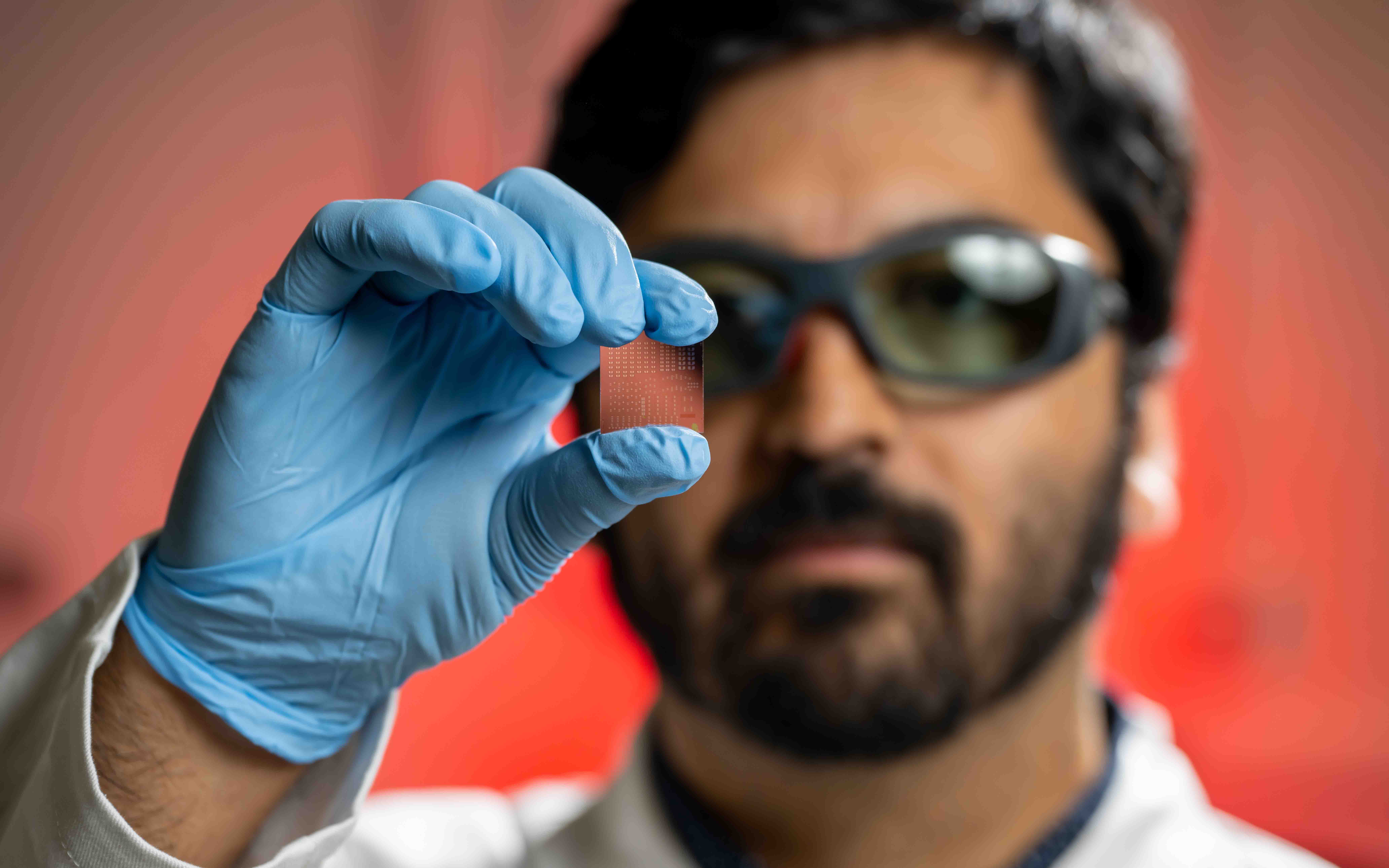 Professor observing microchip.