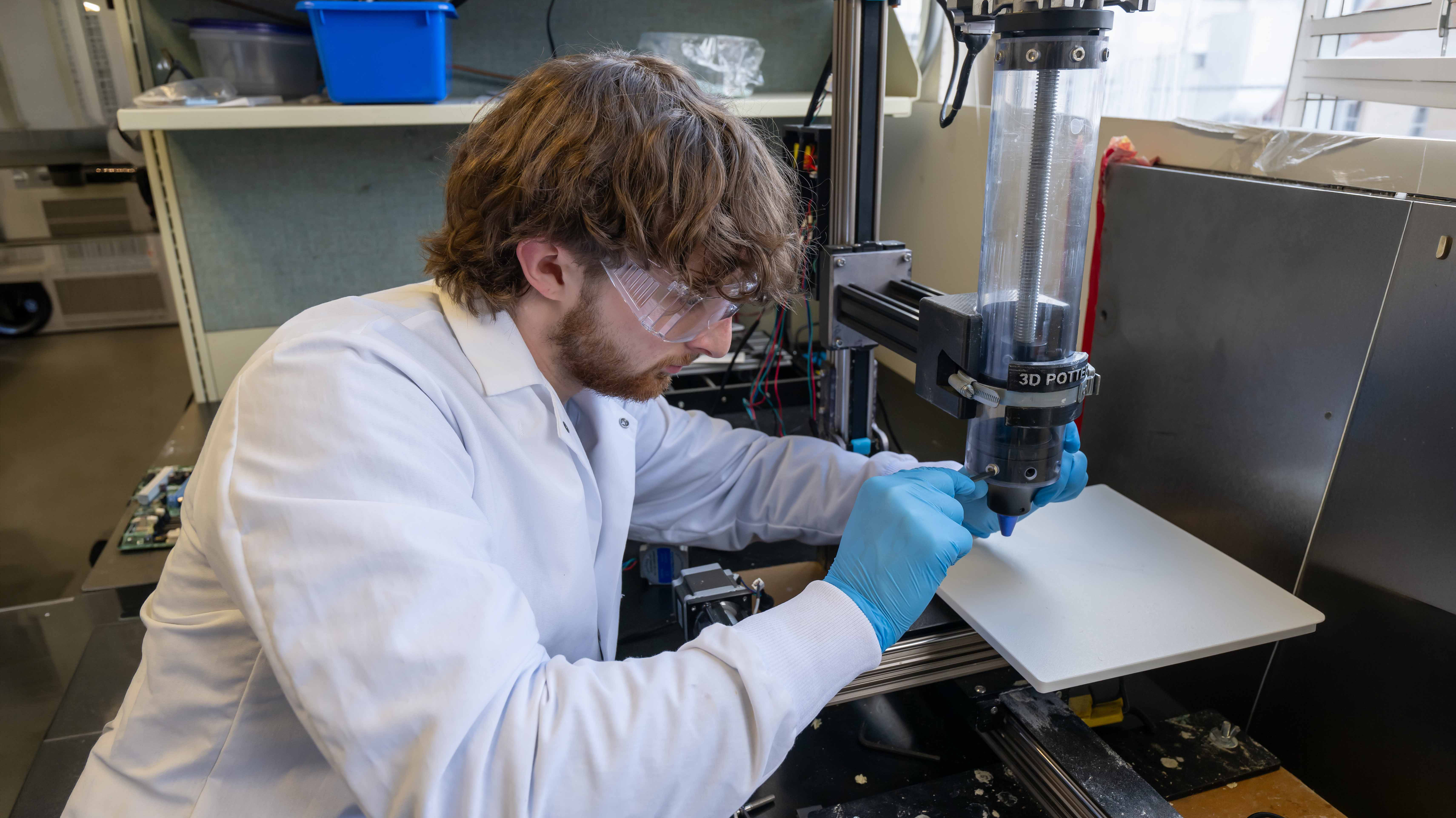 Student Dylan Stone working in lab.